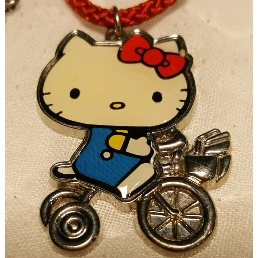 2010 Sanrio Hello Kitty Old School Bike Trike Necklace on Red Cord Appx 2